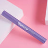 Diamond Smile Lila Zahnbleaching Farbkorrektur Stift vor pinken Hintergrund